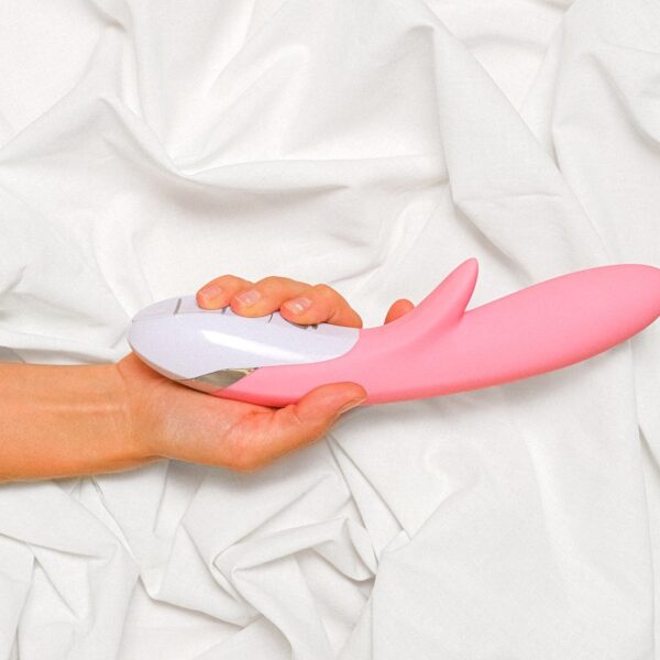 Person Holding a Pink Vibrator