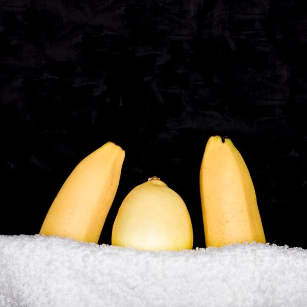 yellow banana on white towel