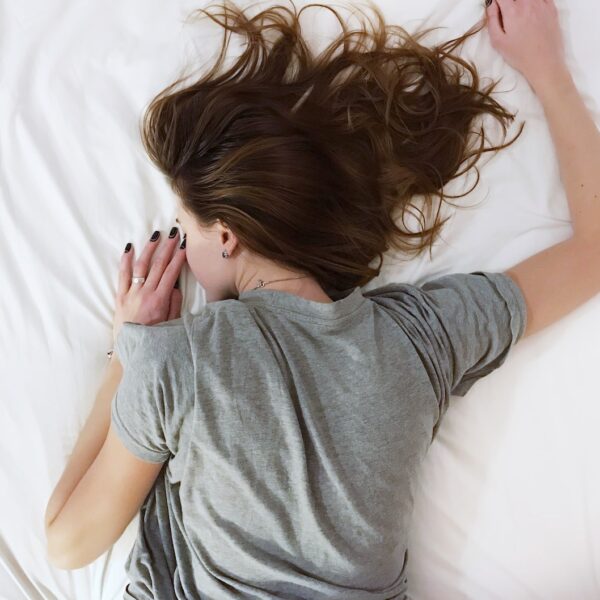 woman laying on bed