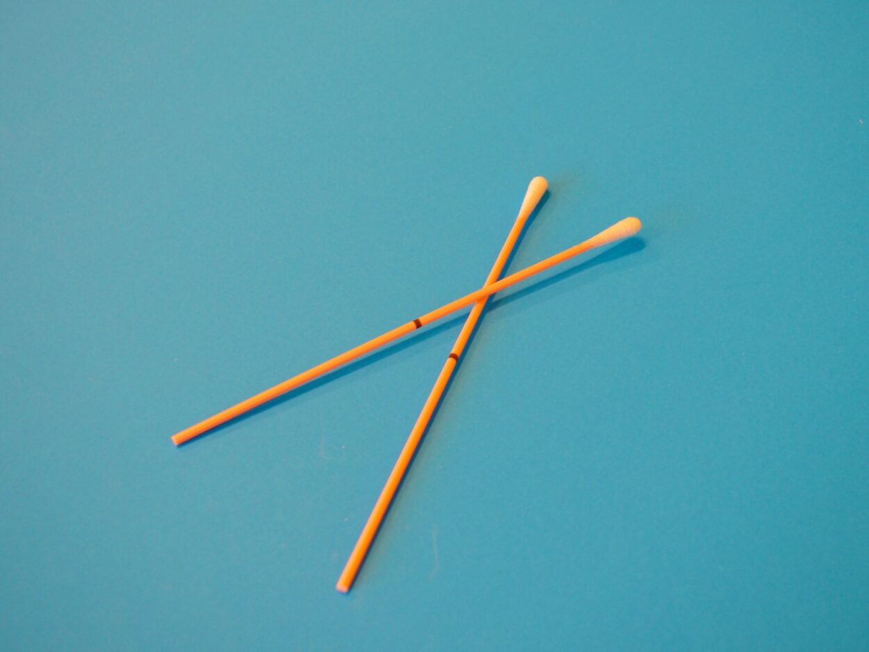 brown wooden sticks on blue surface